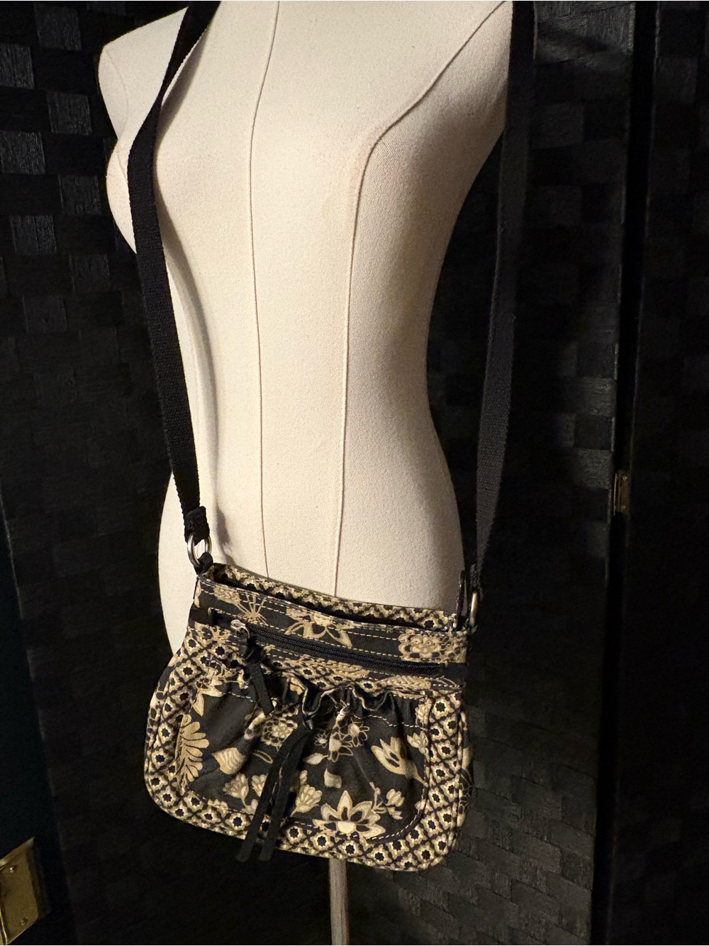 Fossil small black and beige floral print canvas crossbody bag.
